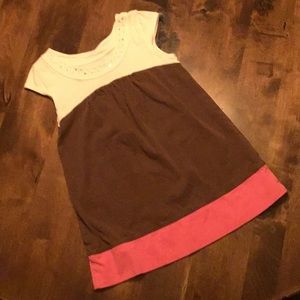 A white brown and pink dress with sparkles.